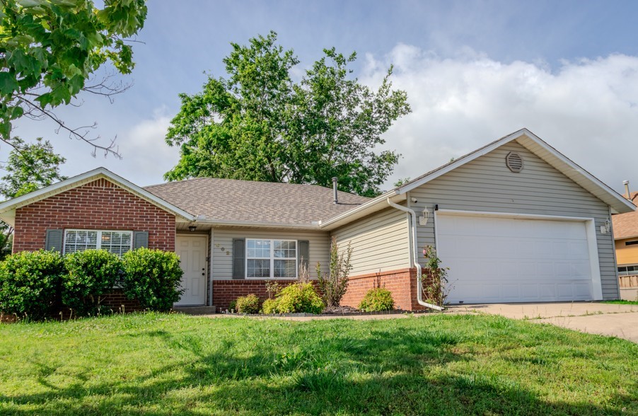 Introducing you to this amazing home in Rogers.Home features 3BR/2Bth with tons of upgrades..A brand new roof was recently installed and a fresh rolled roof over the back patio to match. New exterior A/C unit was added in 2023 and still under a 10-year warranty. Inside, you’ll find an open, split floor plan with granite counters, updated kitchen, and tile flooring throughout the main areas. Primary suite includes a walk-in closet and beautiful sage green bathroom with a clean, simplified layout. The oversized two-car garage includes attic storage, and the laundry room’s been upgraded with extra shelving. Enjoy a spacious fenced-in yard, yearly blooms in the front bed, and a covered back patio made for relaxing or entertaining.
