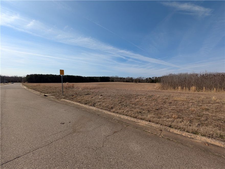 A substantial undeveloped parcel with  high visibility and easy access to I-40. MULTIFAMILY POTENTIAL--- DEVELOPER READY! Level and offers an optimal location for improvements!  Call for NO COMPETE RESTRICTIONS. Property is ideal for large scale projects given the acreage amount and exposure. Close to schools.