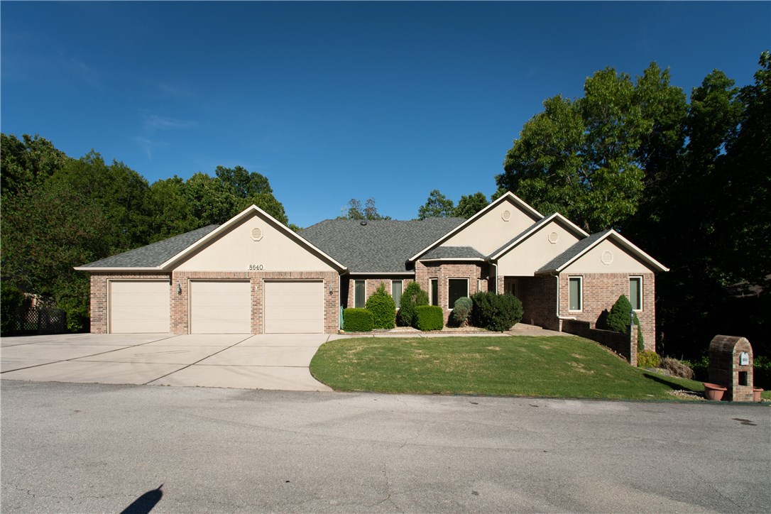Beautiful brick home in well established neighborhood just minutes from downtown Rogers and Beaver Lake. BRAND NEW ROOF, 4 finished garages, 2 heated/cooled workshops in the basement! 4 Large bedrooms all with walk-in closets. Master walkin shower,linen closet. Spacious kitchen has plenty of cabinets and work room on granite counters. Large laundry w/pantry&sink 2 heated/cooled sunrooms one with working hot tub. This home has apprx 1,665sqft of unfinished space in basement not included in SF. Sold "As-Is"