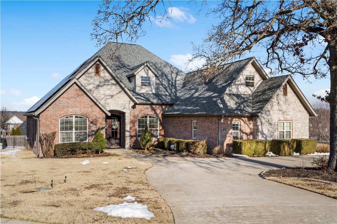 Location, layout and luxury are the stars of this 5 bed, 4.5 bath home situated right off of the Springdale Country Club Golf Course & just minutes from Lake Fayetteville, Tyson World Headquarters & the NWA Mall. Boasting a thoughtfully designed layout w/ abundant space, this home is ideal for families & entertaining alike. Step inside to discover fresh, neutral paint on the walls & cabinets along w/ multiple updates throughout. The main level features an open living area, eat-in kitchen, dining room, office complete with built ins & a versatile bonus room. 4 beds & 3.5 baths can also be found downstairs including the luxurious primary suite. Upstairs you'll find another bonus room & additional bed/bath providing room to spread out. Outside features a large covered back patio & fenced yard. The 3-car garage offers plenty of storage, and the home's solar panels and tankless water heater provide energy efficiency and savings. With its unbeatable location, modern updates, and abundant space, this home is a rare find!