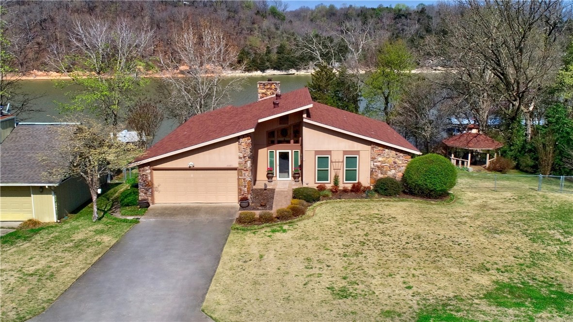 PRIVATE BOAT DOCK at this lovely 2br, 2ba lakefront home on 0.45 acre. Well cared for home
with newer windows, updated kitchen includes new refrigerator, roof 5yrs, water heater 3yrs,
HVAC 2yrs. Lots of storage. Wood burning fireplace, large rooms. Screened porch with room to
entertain. Easy walk to the lake. 10 minutes to town.