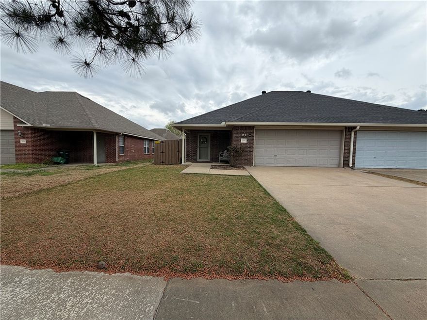 Great 3 bedroom 2 bath home just off I 49, close to bus route and U of A. Kitchen includes all appliances including over range microwave and large pantry. Wood style flooring throughout. Full size washer and dryer included.  Fenced back yard with patio.