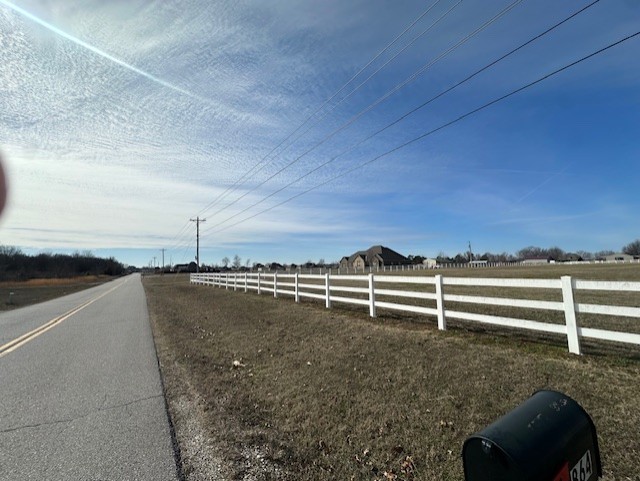 Don't miss out on this outstanding 3.33 acres fully fenced in white vinyl with a private gate! this Location is so desirable to all of NW Arkansas! This land has no covenants and is in an area of estate type homes. Build a shop, have a horse, and park your Rv right at your back door!!!! Cox cable, internet, water, gas, and electric is available.
