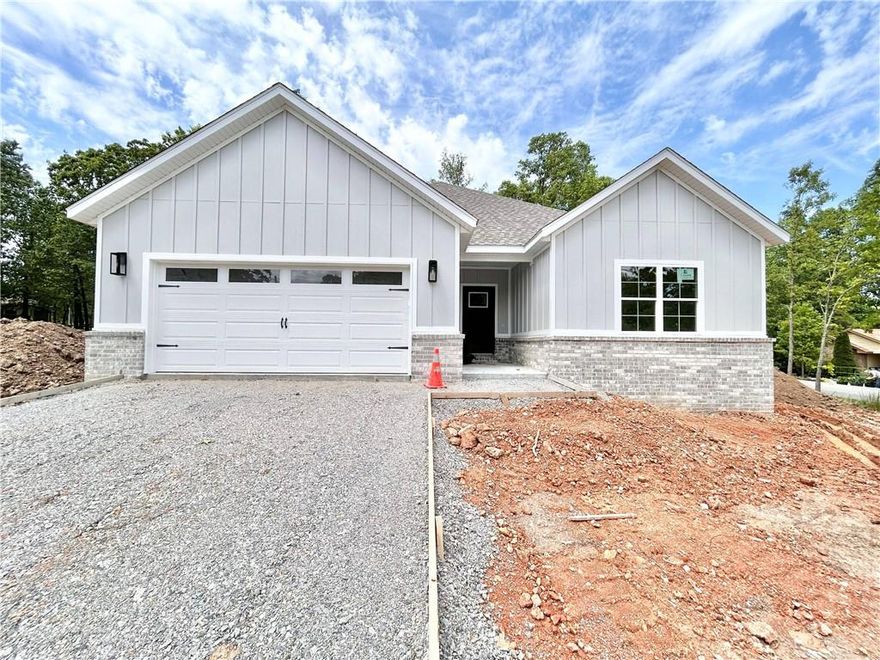 New construction on a flat .35 acre cul-de-sac lot just down the street from Branchwood Recreation and Nature Trail! Also located within close proximity to Highlands Golf Course, Lake Loch Lomond, and I-49. Step inside to discover an inviting open concept design featuring 10’ ceilings and beautiful floors that enhance the spacious feel of the home. NO CARPET. The stylish kitchen is equipped with a gas range, 3 cm quartz countertops, custom cabinets, and a walk-in pantry. Entertain or unwind in the living area, complete with a stunning fireplace, or step out onto the covered patio to enjoy the peaceful surroundings. The primary suite features a massive walk-in tile shower and closet. 2 bedrooms + office.