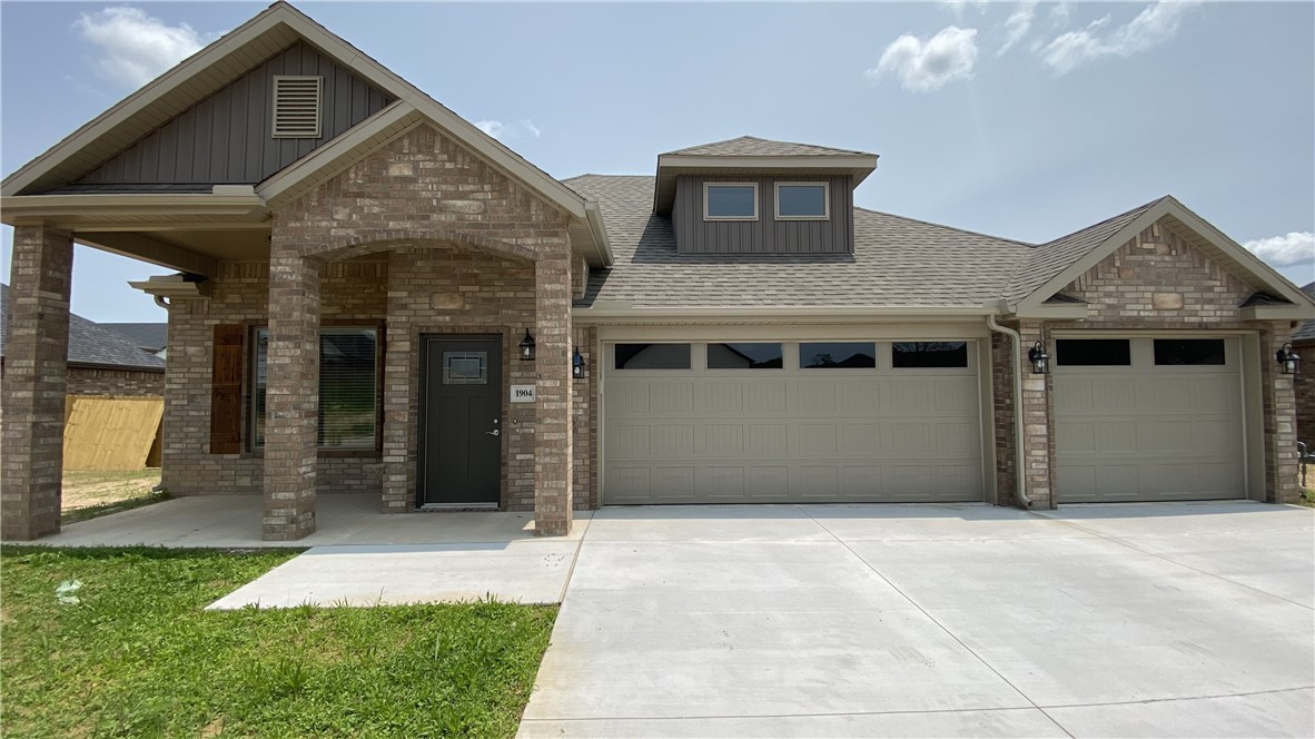 Stunning new construction—this single-story home features 3 bedrooms, 2 bathrooms, and a spacious 3-car garage. The kitchen is equipped with stainless steel appliances, a gas range, microwave vent hood, pantry, and granite countertops. A large fireplace flanked with built-in bookshelves serves as a striking centerpiece in the living room. Elegant details include wood-cased windows with 2-inch blinds throughout. Enjoy great curb appeal with a large front porch, fully sodded oversized yard, and a privacy fence. The covered back porch and fully installed gutters add both comfort and functionality. A keyless garage door pad offers convenient access. The primary suite boasts an oversized tiled shower and a walk-in closet that connects directly to the laundry room, located near the garage for added convenience. Durable brick exterior construction ensures longevity and low maintenance.