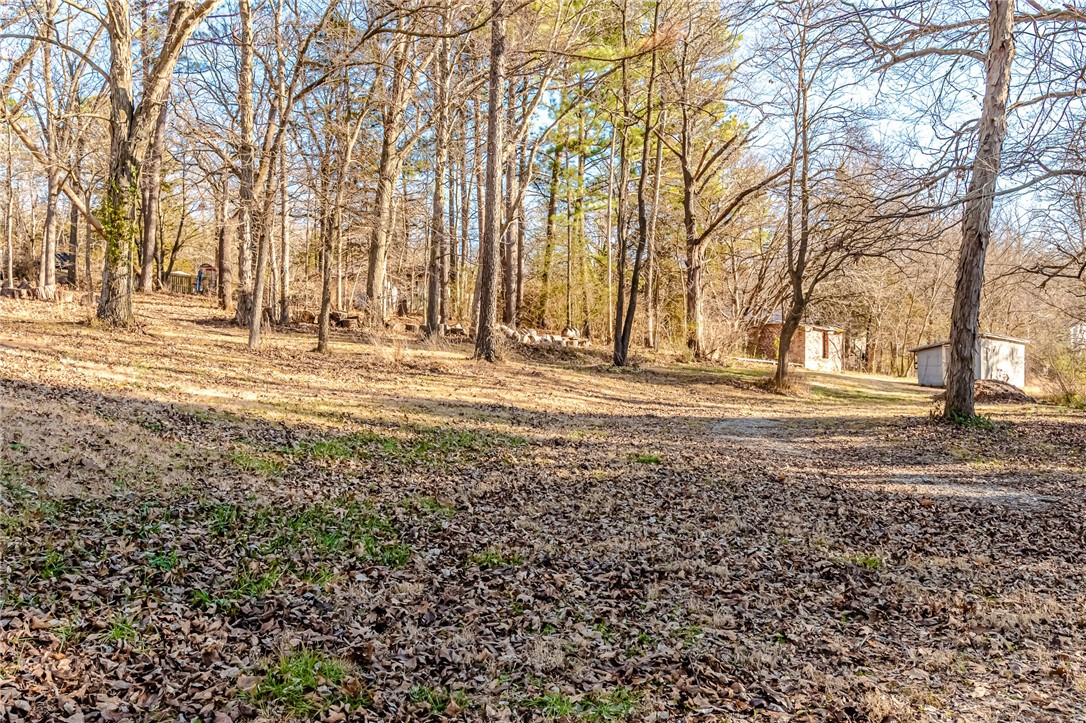 BUILD YOUR DREAM HOME! This 1.09 acres +/- lot is the perfect place to put your roots down! Partially wooded on a gravel drive just off of 71 is convenient to West fork or Fayetteville!
*Two storage buildings on the property convey with the land and are in as-is condition (value is only in the land)