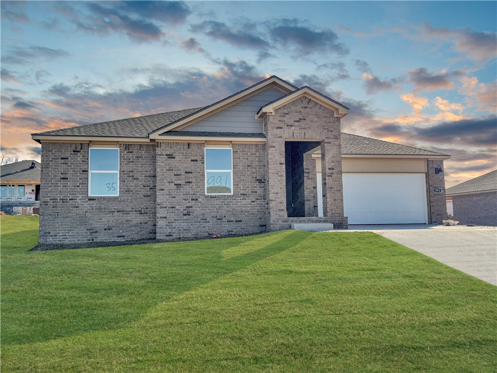 Delightful Dean Plan in Hylton Place! Hylton Place, is where you will find your new home. Located close to the C.L. "Charlie and Willie George Park that consists of walking trails, dog park, splash pad, ball fields, and tennis courts. Easy access to the Don Tyson Parkway. Kitchen is open to the living room. This home boasts gorgeous quartz kitchen countertops, stainless steel appliances, cozy Electric fireplace, and Luxury Vinyl plank flooring throughout! Primary bath has an oversized shower, walk in closet and dual sinks with quartz countertops. Fans in all bedrooms as well as the living room! This home exterior will have 4 sides brick! Covered patio and a landscape package. Garage Door opener! Tankless hot water heater! Hylton Place. Make it home!