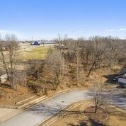 Build your dream home with a back deck that could overlook jb hunt park. Beautiful neighborhood in harber meadows school district. This property is a gently sloping lot with survey provided as well as site plan and floor plan. See attached documents. Welcome to use site plan attached. Make sure and watch the virtual drone video!