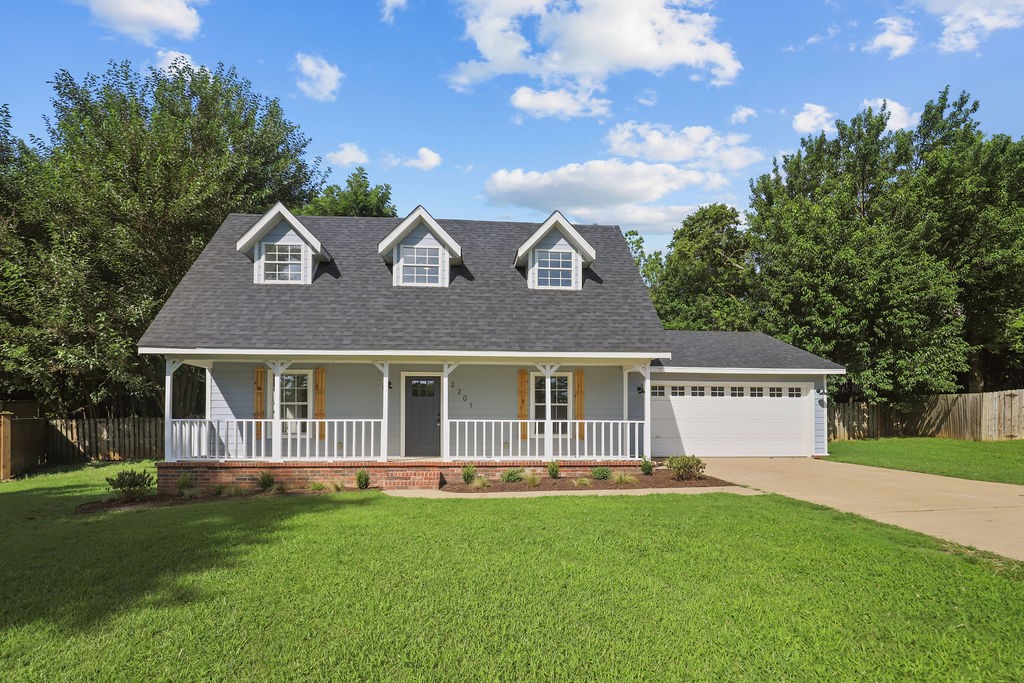 Beautifully renovated craftsman-style home in the desirable East Fayetteville Park Place neighborhood. This property sits on over half an acre of mature, tree-lined privacy with a charming front porch. Step inside to discover refreshed interiors with new LVP flooring throughout the main level, new carpet upstairs, and fresh paint on walls, trim, and cabinets. The updated kitchen features quartz countertops, new backsplash, stainless appliances, and pantry, while the refinished fireplace creates a cozy focal point. The master suite offers a completely renovated bathroom with double sinks, quartz counters, and luxurious walk-in tiled shower. Upstairs, two bedrooms each have generous walk-in closets and attic storage, sharing a Jack-and-Jill bathroom with quartz countertops. Highlights include new dual-zone HVAC, recently replaced roof, epoxy garage flooring, and new rear deck overlooking the private backyard.