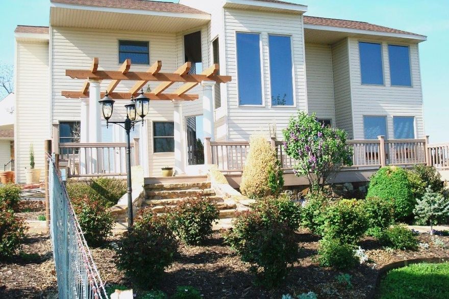 Eagle Ridge Ranch located in the Ozark Mtns between Harrison,AR & Branson,MO. Table Rock, Bull Shoals & Taneycomo lakes are just minutes away. Located on 209 acres, there is an abundance of wildlife & 30 mile views across the Ozark Mtns. Valleys, ravines, ledge caves, pastures, 2 springs, woods & a 20' waterfall. The 2000SF deck, outdoor FP & pergolas create a perfect outdoor entertainment atmosphere. The main home includes a magnificent study, gourmet chef kitchen, great room, expansive master suite with breathtaking views. 2 metal barns, one a hay barn with attached covered loafing pens w/water & electricity. Equipment barn has 4 lrg bay doors, concrete floor,water & electricity. There is also a 2112SF guest home/foreman's house/rental unit. The property is fenced & cross fenced into 4 pastures with 2 small ponds, heated waterers & working pens. This dream home would make a great corporate retreat/vacation/get away/permanent residence. Please see Historical Narrative, pictures #29 & #30.