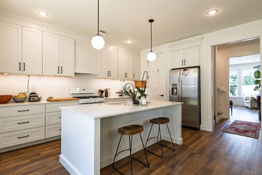 Architecturally Designed Townhome Near Dickson St. & Fayetteville Square

Beautifully designed 3-bedroom, 2.5-bath townhome just blocks from Dickson Street and the Fayetteville Square. This modern home features an open kitchen with quartz countertops, custom cabinetry, under-cabinet lighting, stainless steel appliances, a gas range, and a spacious island with barstool seating—perfect for gathering with friends or family.
The primary suite offers a walk-in closet, ceiling fan, dual vanities, and a luxurious walk-in shower. Nine-foot ceilings throughout enhance the open feel, while the fenced backyard and two-car carport add both comfort and convenience.
Extras included: mounted TV, adjustable standing L-shaped desk, trundle bed in the yellow room, outdoor storage unit, snow shovel, and two lawn chairs—ready for move-in ease.