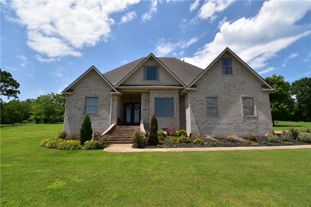 Incredible very well built highly finished out 5 bedroom 4 bath home, 3 car garage on spacious 1 acre lot and easy access to downtown Bentonville and Walmart Headquarters. Bentonville School District. Inviting home built to entertain family & friends was designed for future swimming pool. Master bedroom suite and 5th bedroom located on the first floor both have direct patio access.
Bricked step front entry leads to double French door foyer & large dining room, living room and grand open plan custom kitchen with built in double oven, gas cooktop, food prep island & bar sitting. Kitchen breakfast leads to backyard patio. Master bath his & her vanities & separate closets, custom walk-in shower and whirlpool tub, marble tile, 3 cm granite throughout, crown molding, luxury plush carpet, high end vinyl wood grained flooring. The details such as under eave lighting, herringbone bricked gable, backside roof gables, mylar backed roof decking, foamed attic walls & more go to the homes value. Schedule your tour today!