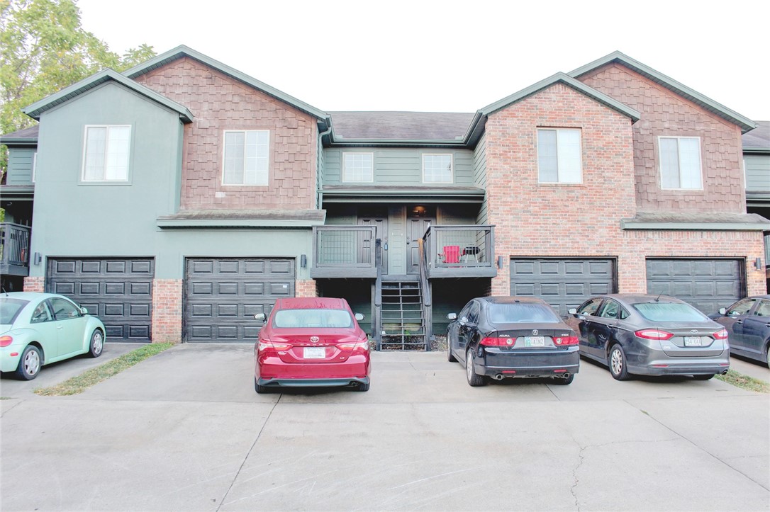 Welcome home to a condo located steps from the trail system connecting all of Northwest Arkansas and just North of the University of Arkansas. Imagine a spacious living room with new flooring and vaulted ceilings that are part of an open living plan that includes a separate dining space and kitchen as part of the area. The kitchen, which is open to the living room comes with all appliances (refrigerator, range, microwave and dishwasher). The main level includes a bedroom with vaulted ceiling, double window, ceiling fan and access to full bathroom immediately out the door. On the lower level are two bedrooms each with double windows, ceiling fans and an additional full bathroom. Both bathrooms have a combination tub/shower. If that isn't enough, the washer and dryer are included, and you will have a garage and a front deck to enjoy. *Agent Owned*