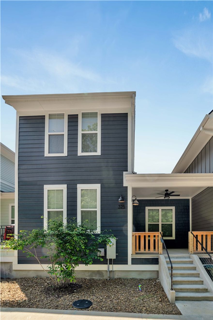 Experience the best of downtown Fayetteville living in this stunning townhome. Spanning three levels, this beautifully crafted residence features 3 bedrooms, 2.5 bathrooms, flexible bonus space, and an oversized attached two-car garage. Premium touches such as Hardie siding, rich wood flooring, contemporary fixtures, designer lighting, and a walk-in closet elevate the home’s appeal. Perfectly positioned in the Arts District, Fayetteville Library, The Ramble, and just a block from The Greenway trails within walking distance of Dickson Street’s dining and entertainment, this home offers a rare blend of urban convenience and modern luxury. Whether for full-time living or as an investment, this is a standout property in a sought-after location.