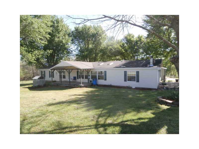 Too nice to be a modular. On permanent foundation. Should go VA or FHA. Family room could be 5th bedroom. 2 fireplaces. Fenced for cows or horses. 24X30 shop & an implement shed. Trees on back of lot.