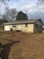 706 Hwy 213, Hattieville - 2 bedroom, 1 bath brick home on .36 acre. One block from Hattieville Grocery. House is structurally sound but needs some TLC. REDUCED $39,900. MLS#17-92