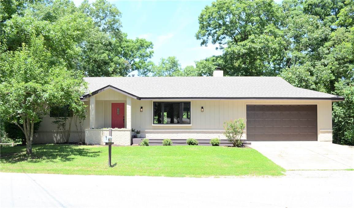 Updated throughout! This walkout basement has an amazing floor plan! 3 BR, 3 Full Baths, 2 generous living areas, 3 garages + 450 sq ft workshop or storage (not included in total) all on a corner lot with easy access to Hwy 71. Open concept living that is light, bright, and ready to move in. New Roof! Furnace and HW heater 2017. All new flooring, lighting, granite tops, bath fixtures, interior/exterior paint and more. The lower level garage provides separate/private entrance to the basement-perfect for boat,toys, or even a roommate situation. The corner setting also allows for additional parking. Additional lot conveys for added privacy. Don't miss this charming home. Agent related to Sellers.