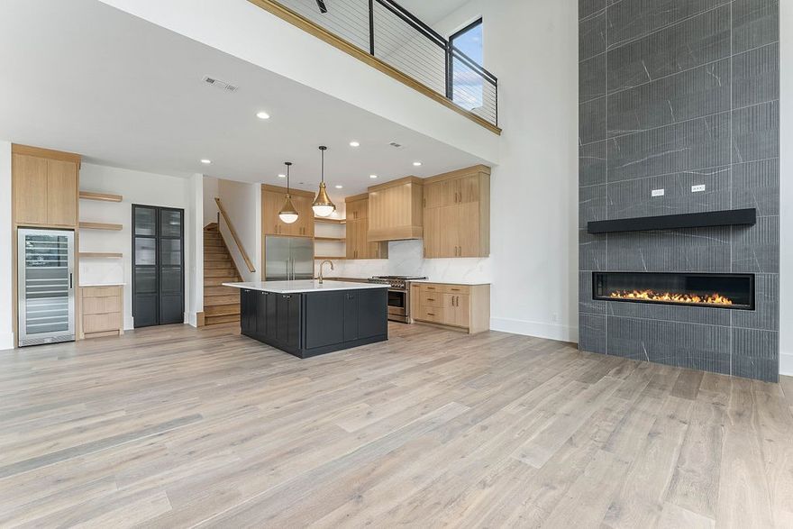 Experience modern luxury living in the heart of downtown Bentonville with this stunning new construction home, designed for comfort and entertainment with seamless indoor/outdoor flow. Boasting 20-foot ceilings, open living spaces filled with natural light, and luxury finishes throughout, this home features a gourmet kitchen with custom rift-sawn oak cabinetry, high-end appliances, a wine and beverage fridge, ice maker, and walk-in pantry. Enjoy the flexibility of an executive office, bonus entertaining room or bar, spacious bedrooms with walk-in closets, and a garage apartment with a separate entry, perfect for a short-term rental or next-gen living. Located steps from the new Walmart Home Office, AWSOM Medical School, Crystal Bridges, and a vibrant community filled with restaurants, shopping, and entertainment, this is your chance to live the downtown lifestyle. Schedule your tour today! Landscaping, fence & driveway to be installed by 6/20.