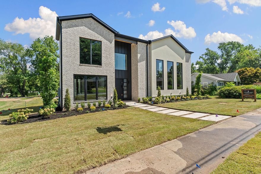 Modern Architecture. Downtown Prestige. Private Luxury. Stunning new construction in the heart of downtown Bentonville, offering modern luxury and exceptional versatility. Designed for effortless living and entertaining, this home features soaring 20-foot ceilings, light filled open spaces, and high end finishes throughout. The gourmet kitchen showcases custom rift sawn oak cabinetry, premium appliances, wine and beverage refrigeration, ice maker, and walk-in pantry. Flexible floor plan includes a private executive office, additional entertaining or lounge space, spacious bedrooms with walk-in closets, and a detached garage apartment with separate entrance ideal for guests, next gen living, or short-term rental potential. Expansive yard with room for a pool and outdoor entertaining. Prime location near the new Walmart Home Office, Alice L. Walton School of Medicine, Crystal Bridges, dining, shopping, and trails; an exceptional opportunity to own in one of Bentonville’s most sought after downtown locations.