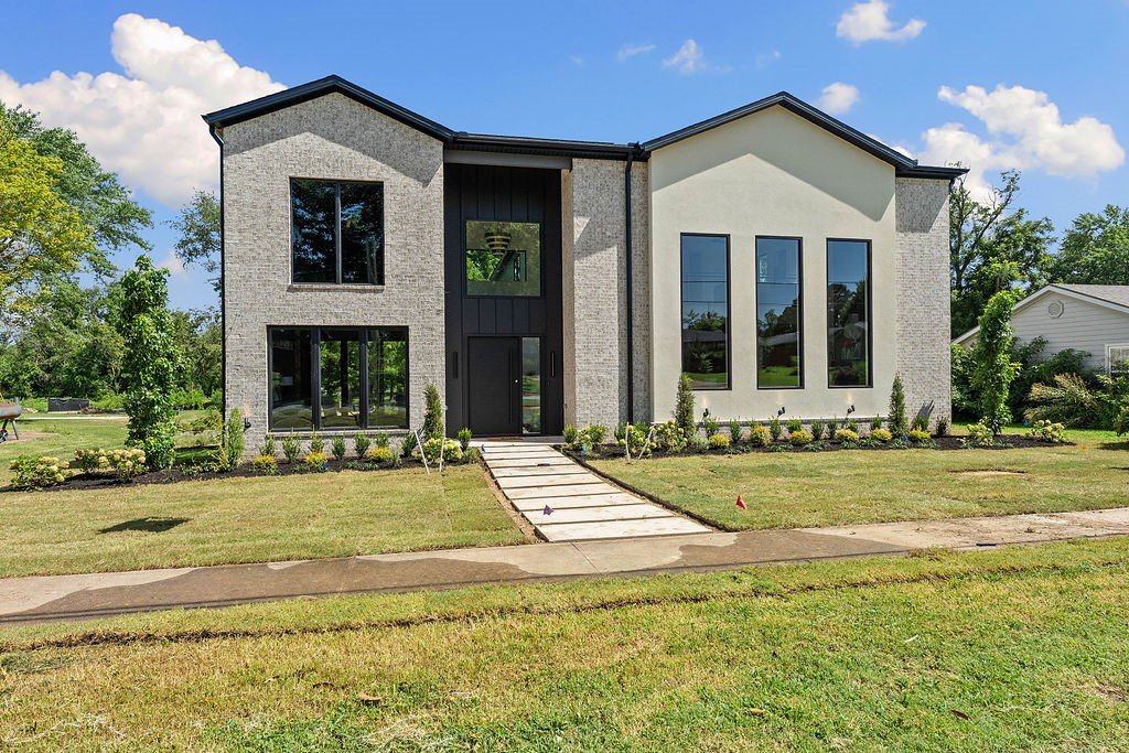 Experience modern luxury living in the heart of downtown Bentonville with this stunning new construction home, designed for comfort and entertainment with seamless indoor/outdoor flow. Boasting 20-foot ceilings, open living spaces filled with natural light, and luxury finishes throughout, this home features a gourmet kitchen with custom rift-sawn oak cabinetry, high-end appliances, a wine and beverage fridge, ice maker, and walk-in pantry. Enjoy the flexibility of an executive office, bonus entertaining room or bar, spacious bedrooms with walk-in closets, and a garage apartment with a separate entry, perfect for a short-term rental or next-gen living. Located steps from the new Walmart Home Office, AWSOM Medical School, Crystal Bridges, and a vibrant community filled with restaurants, shopping, and entertainment, this is your chance to live the downtown lifestyle. Schedule your tour today!