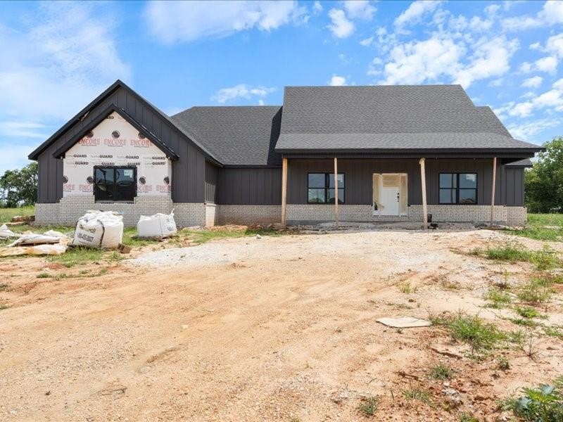 Welcome to this stunning new construction home, where farmhouse charm meets luxury living. Nestled on almost an acre, this custom-designed home boasts exceptional craftsmanship & thoughtful details throughout. The home features a covered front porch that invites you to relax & enjoy the serene surroundings. Inside, you'll be greeted by an open-concept living area that seamlessly flows into a beautiful kitchen, complete with quartz countertops. The split floor plan offers privacy & comfort. Designed with a nod to farmhouse style, yet infused with high-end finishes, this property is perfect for those seeking both style & functionality. Don’t miss the opportunity to make this incredible house a home.