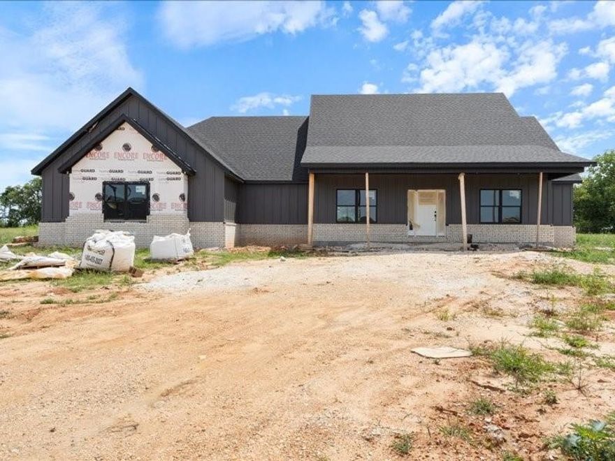 Welcome to this stunning new construction home, where farmhouse charm meets luxury living. Nestled on almost  an acre, this custom-designed home boasts exceptional craftsmanship & thoughtful details throughout. The home features a covered front porch that invites you to relax & enjoy the serene surroundings. Inside, you'll be greeted by an open-concept living area that seamlessly flows into a beautiful kitchen, complete with quartz countertops. The split floor plan offers privacy & comfort. Designed with a nod to farmhouse style, yet infused with high-end finishes, this property is perfect for those seeking both style & functionality. Don’t miss the opportunity to make this incredible house a home.