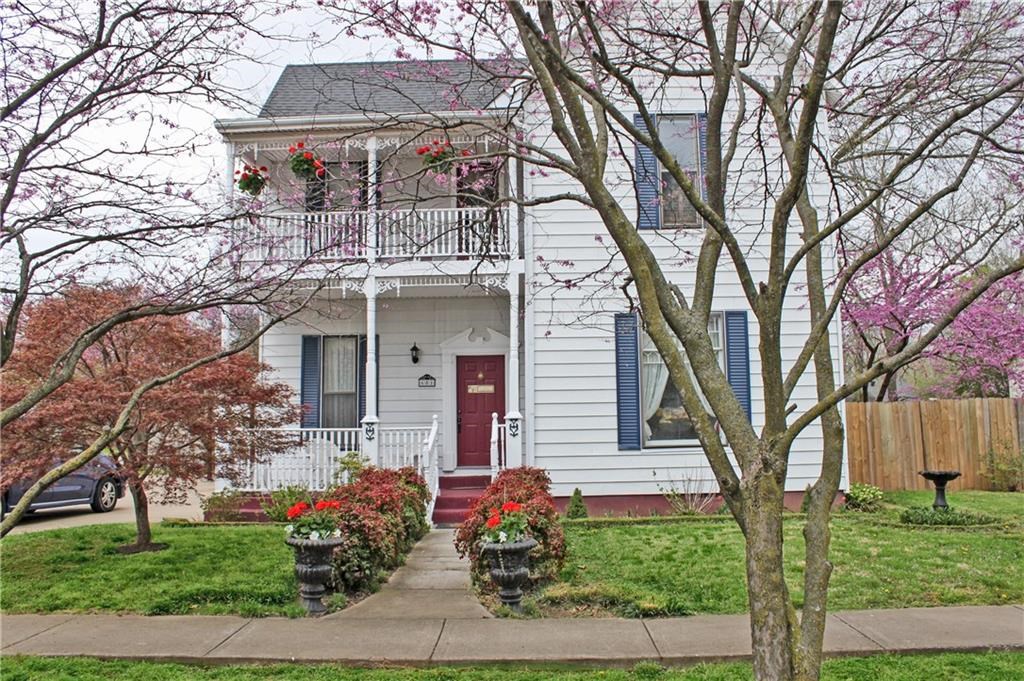 This Victorian charmer has two covered patio/balcony areas. This home is just blocks from much sought after downtown Bentonville location. The homeowners have updated yet kept much of it's original charm. There is a 4th room on main floor that has been used as a bedroom, with an armoir(which is available)/new vinyl plank flooring and fresh paint throughout.