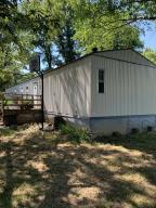 18 acres of paradise waiting for you! Come see this 3 bedroom, 2 bathroom, split floor plan, 16x80 single wide mobile home. HUGE 50x40 METAL SHOP with electric and water already installed! Property has rural water, but also a well! This is a must see!