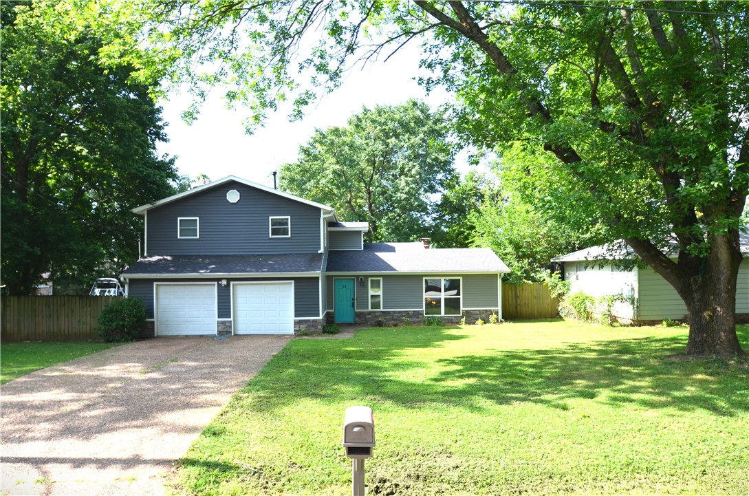 Rare opportunity to own an updated home on nearly half an acre in town. New deck in 2024. Electrical panel, siding, roof and HVAC replaced approximately 2019. New windows, appliances and some flooring in 2020. There is a whole home generator that is a back up power source for your peace of mind. Whole home air purification system. In the winter you can cozy up to the living room's wood burning fireplace. In addition to the 3 bedrooms there is an office/flex space. The backyard is fully fenced and has a nice storage buildings for all your storage needs. Enjoy the peaceful sound of the waterfall on the Koi pond. The natural gas fire table conveys. The 2 car garage is near the kitchen for ease of bringing in those groceries. Great ambience with soffit can lights and under counter lights. You'll love the convenient location near schools, parks and businesses, yet a true neighborhood feel. This one will be popular so schedule your showing soon.