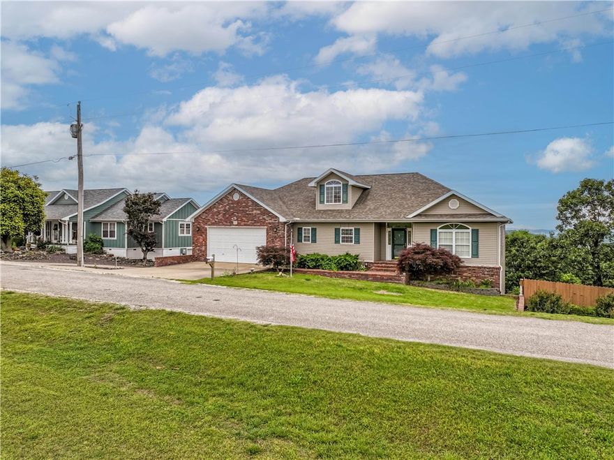 Stunning Home with Ozark Mountain Views – Across from Golf Course! The home offers breathtaking views of the Ozark Mountains from the rear decks & is ideally located directly across the street from the golf course. The home features 3 spacious bedrooms, 2.5 bathrooms, & a dedicated executive office, this property is designed for comfort and functionality. The main level features an attached 2-car garage, while the lower level includes a separate golf cart garage – perfect for enjoying the nearby greens. Just a short walk brings you to the main clubhouse. Community pools along with other amenities are only a quick drive away. There's also a full-service marina on Table Rock Lake with boat slip rentals available for your watercraft & for everyday convenience? Just across from the main entrance is a well-equipped shopping center featuring a grocery store, hardware store, restaurants, and more. This home truly has it all – views, location, amenities, and lifestyle. Schedule your private showing today before it's gone!