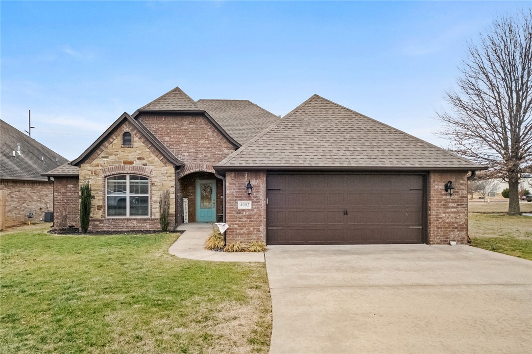 Beautiful, one-owner Rouse Custom Home in the highly sought-after Cornerstone Ridge subdivision! This single-level, 4-bedroom, 2-bath home offers an open, split floor plan with hardwood floors, granite countertops, and stainless steel appliances. The spacious master suite features a tiled walk-in shower, whirlpool tub, and double vanity. Enjoy outdoor living on the large covered patio overlooking the community fishing pond. This home is situated at the end of a quiet cul-de-sac with access to neighborhood amenities including playground and walking trails, and fishing pond. Conveniently located near the Walmart DC and many other Bentonville shopping centers and amenities within a few miles.