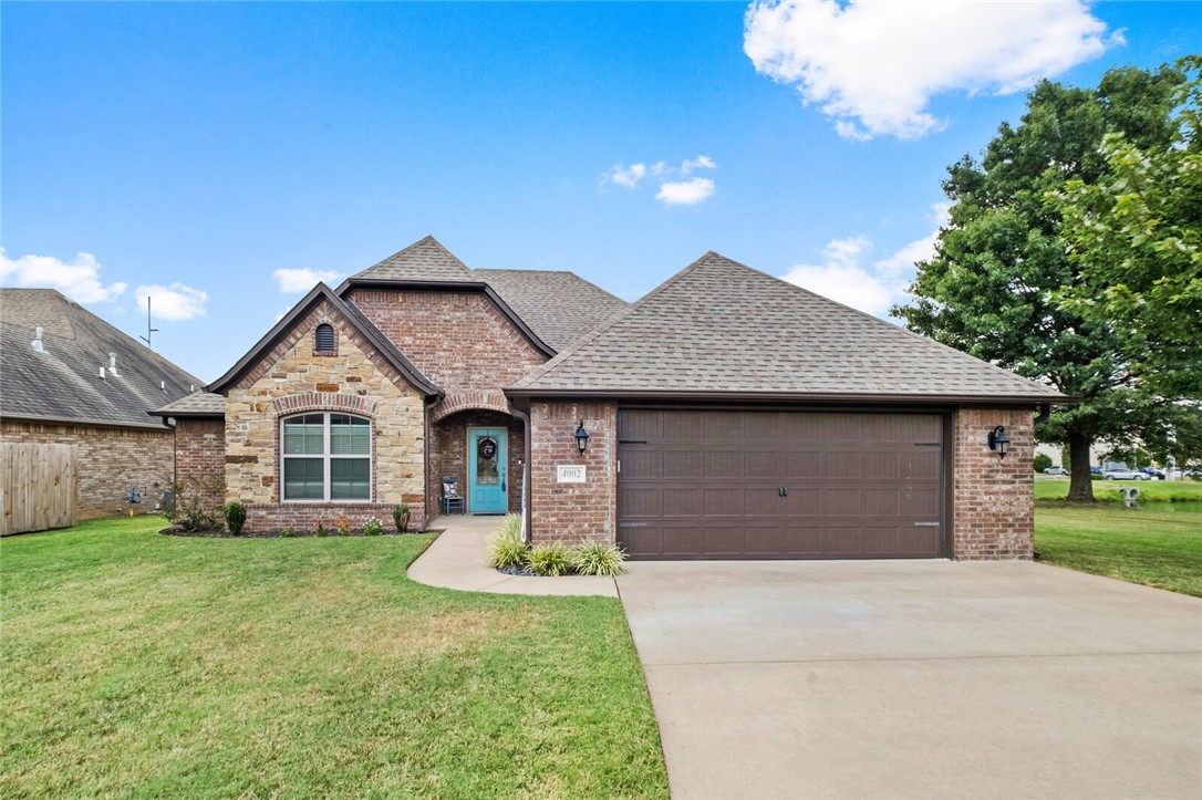 Beautiful, one-owner Rouse Custom Home in the highly sought-after Cornerstone Ridge subdivision! This single-level, 4-bedroom, 2-bath home offers an open, split floor plan with hardwood floors, granite countertops, and stainless steel appliances. The spacious master suite features a tiled walk-in shower, whirlpool tub, and double vanity. Enjoy outdoor living on the large covered patio overlooking the community fishing pond. This home is situated at the end of a quiet cul-de-sac with access to neighborhood amenities including playground and walking trails, and fishing pond. Conveniently located near the Walmart DC and many other Bentonville shopping centers and amenities within a few miles.