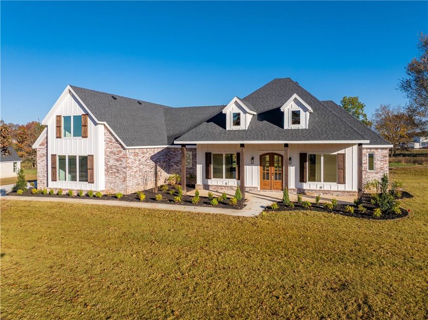 Discover this stunning new construction home on a sprawling 1.7-acre lot with breathtaking views and easy access to Tontitown’s vibrant amenities. Thoughtfully designed, it blends modern luxury with timeless charm. Inside, an open kitchen and living area feature stylish LVP flooring, ideal for both casual gatherings and formal dining. The master suite offers a tranquil escape with dual vanities, a spacious walk-in closet, a walk-in shower, and a soaking tub. With three additional bedrooms, an upstairs bonus room with bath, and a 3-car garage, there’s plenty of room to live and store. Enjoy the expansive yard and covered patio, perfect for embracing NWA’s beauty. Don’t miss the chance to make this home yours.