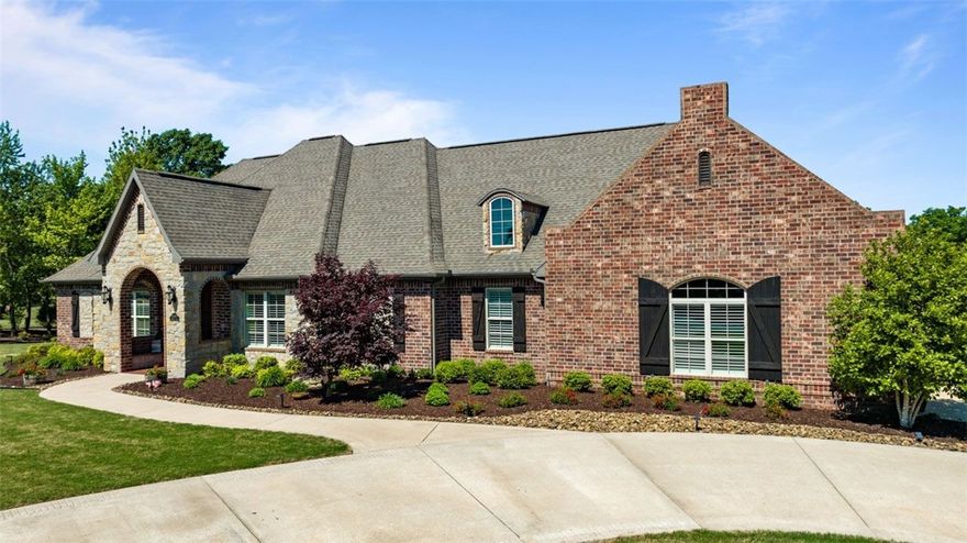 A breathtaking home greets you atop a private stone bridge entrance to 9.63 AC. Attention to detail can be seen throughout the property from beautiful hand scraped hard wood floors & peaceful, neutral color palate to meticulous landscaping around home. Plus many more things to boast about like: interior is all 1 level, full home generator, attached shop area/storage can be found off the lower patio, interior home storm closet, wide stairs leading to a spacious attic, generously sized main bedroom, a full bathroom per bedroom + an additional half bath off the kitchen for guests, behind your murphy door hides a secret cupboard,  "hidden" walk in pantry awaits behind large cabinet doors -outlets inside to keep those small appliances free from counters, Central Vac, & solar shades along areas of back. The Crestron Control System will control your home audio/video/lighting.  Enjoy privacy as you sip your morning coffee on the back covered porch while admiring the sounds & views of nature. Come view this serene home now!