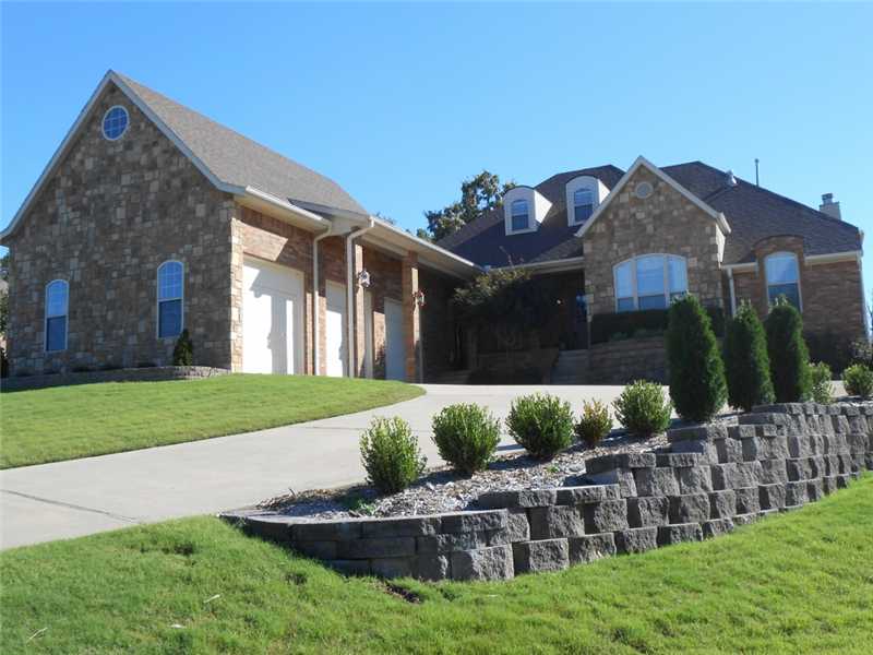 Awesome Cave Springs home in Wellington Subdiv. (Pool & Clubhouse). 5BR, 4BA, 3car garage - one bedroom & bath in garage apartment (mother-in-law quarters). Cooks kitchen with new corian countertops & tile backsplash, open to huge living area,with fireplace. Nice deck & also a private courtyard out master bedroom. New roof & new AC 2014.