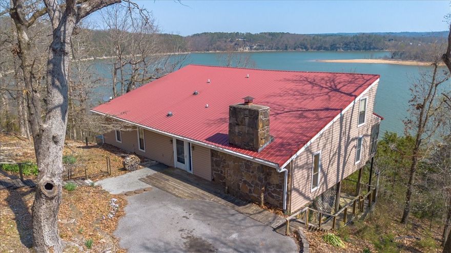 Can you see yourself awakening to the amazing lake view from your bedroom? Enjoy the view while making coffee to sit and enjoy in one of your two all-season lake view sunrooms, taking in the peaceful surrounding nature. Stunning one of a kind year-round view of Beaver Lake - Horseshoe Bend.
Rare opportunity to have 4+ acres; 368 feet of Beaver Lake shoreline right on Horseshoe Bend with a cute cabin/cottage core style home with stairs and a deck to lake.
Plenty of space and sites to build homes for family, Air BNBs, or sell. Endless opportunities and unforgettable views!
Horseshoe Bend Marina is closest boat dock/slip rental; MonteNe is closest boat launch.
Close to town with all paved roads; 10-15 minutes to downtown Rogers; 4 minutes to famous MonteNe Chicken Restaurant. The proximity to NWA features and being "on" the big lake (not a cove) with all-year-round extended, unobstructed lake views is what will make your lake life living perfect. You don't find this combination often. 

Sold "as is"