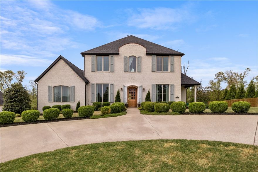 Experience the perfect blend of elegance and comfort in this stunning luxury French country home, located in the highly desirable neighborhood of Versailles, just minutes from Downtown Bentonville. 
This impressive home: A spacious open floor plan, designed for effortless entertaining, showcasing a gorgeous kitchen complete with a huge island and double sinks.
A luxurious primary suite and a guest bedroom both conveniently on the main level, beautiful hardwood flooring throughout.
Upstairs, discover 3 generously sized bedrooms, each with its own ensuite bathroom, ensuring privacy and comfort for family and guests alike. An extra laundry room on the second floor adds convenience to your daily routine.Unwind outdoors in the large, private, wooded, and fenced backyard that boasts a beautiful pool—perfect for summer gatherings. Additional highlights include a 3-car garage, a brand-new roof, and an enchanting secret room behind a hidden door, ideal for a playroom. 
Don’t miss this extraordinary home.