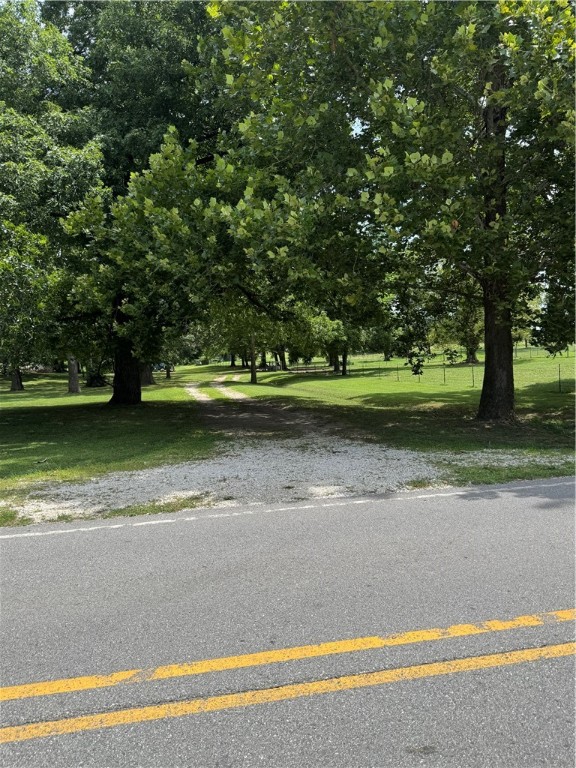 Private 1.48 acre, more or less, lot ready for your custom home. Located on the western edge of Farmington, you will enjoy the country life with only a short drive to all of NWA. Beautiful mature trees stud the lot and offer shade and canopy that takes decades to create. Only 11 minutes to I49. Water and
Ozark Electric/OzarksGo Fiber Internet as street. 60' wide easement with a geocell gravel driveway. Fully fenced. Approved septic design and permit.