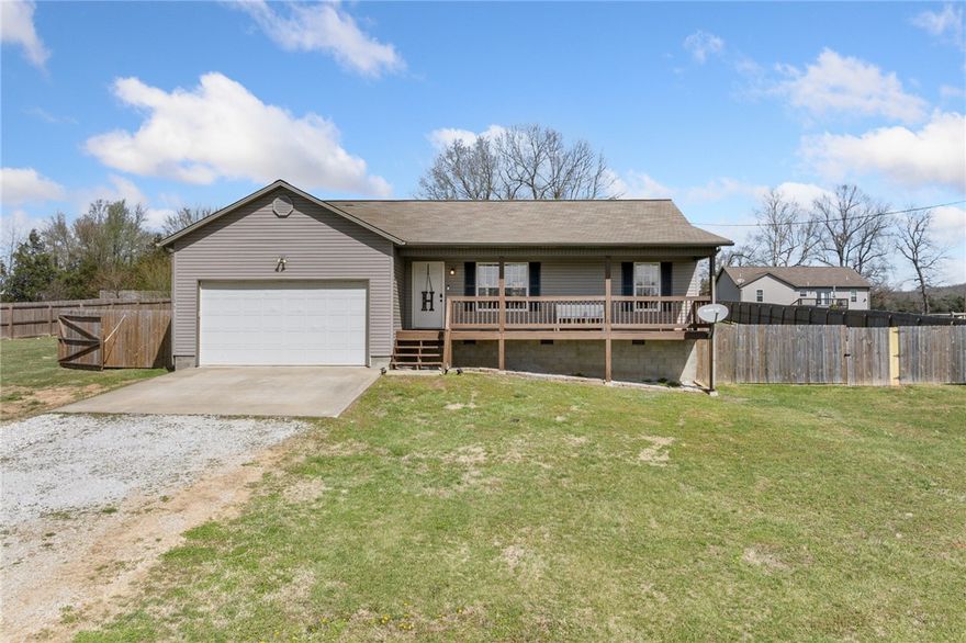 NEW ROOF BEING PUT ON & IN PROCESS! 3 bed, 2 bath home situated on a large, level lot in a peaceful country setting. Features include a spacious back deck, privacy fence, and 2-car garage. Inside offers an open floor plan with cathedral ceilings, a large primary suite with walk-in closet, and a stainless steel appliance package, creating an inviting and functional layout throughout.