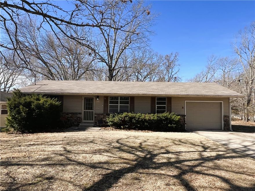 Welcome to this charming 3-bedroom, 1.5-bathroom home located in the desirable Lake Avalon Subdivision of Bella Vista, AR. This home boasts a one-car garage, providing ample storage and parking space. The sunroom is a standout feature, offering a bright and inviting space to relax and enjoy the natural light and a wood burning stove so you can enjoy the sunroom in comfort during the cold season.. The property also benefits from a well-maintained yard, perfect for outdoor activities or simply enjoying the beautiful surroundings. With easy access to downtown, you'll have the convenience of city living while enjoying the tranquility of a suburban setting. This home offers the perfect blend of comfort, convenience, and charm. Don't miss out on this wonderful opportunity!