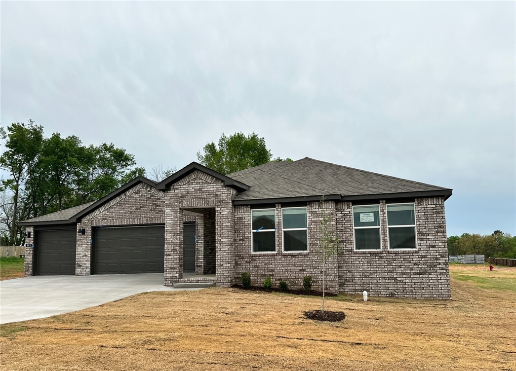Sold before print! Delightful Dean plan (With a 3-car garage!!) Find your new home in Northwest Arkansas in Hudson Heights in Prairie Grove. These homes have fabulous features for comfortable, modern living. Each home features LVP flooring throughout! The living room features a beautiful electric fireplace with a poplar mantle! Kitchens have Quartz countertops, stainless steel appliances, and a stainless steel undermount kitchen sink with a pull-out faucet! Bedroom one with en-suite will feature a ceiling fan, quartz counters with dual sinks, oversized Walk in Shower and a walk-in closet. Home will be 4-sided brick, covered patio (per plan) Taxes and Parcel TBD. Have your agent take you to our model at 1002 Vista!