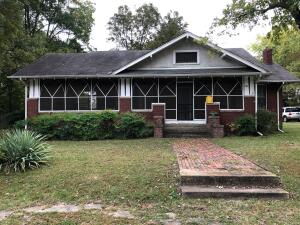 A BLAST FROM THE PAST.... this home offers 3 bdr, 2 bth, formal dining, detached garage/shop, covered parking shed, original hardwood floors, basement, floored attic, HUGE wrap around screened porch, claw foot bathtub, extra wide hallway, fireplace, and the list goes on & on. A MUST SEE to appreciate.