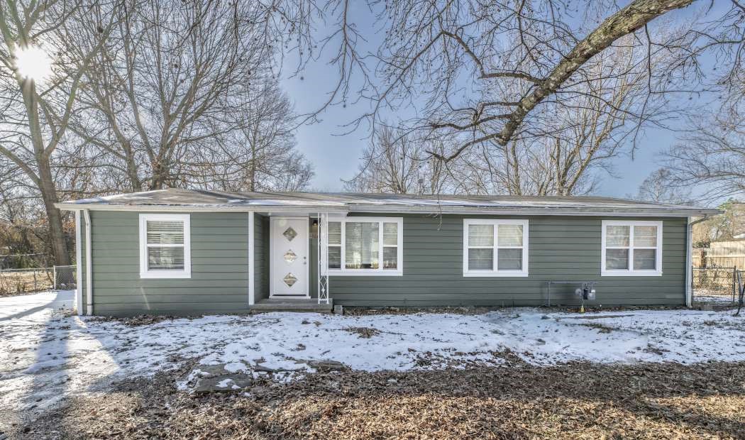 Come see this charmer! Located only 1 mile from the U of A campus, just east of I-49, and minutes from grocery stores, schools, dining, and walking trails! All nestled in a quiet neighborhood you will enjoy for years to come. Modern updates include all-new exterior and interior paint. New HVAC in 2023 and a new water heater in 2024. With new lighting, countertops, fixtures, and refinished original hardwood flooring throughout, you can't go wrong. This charming home includes 3 bedrooms and 1 bath with installed electric heat flooring and a converted garage makes for a wonderful bonus room perfect for an office or additional living area. With almost a half-acre lot, you will be able to enjoy the large, fully-fenced backyard covered with mature trees, a 9ā x 15ā shed (with electric!), a drive-through gate, and no restrictions on adding a shop, covered RV pad, or anything your heart desires. There are so many possibilities. It won't last long so get in to see this gorgeous home before it's gone! Agent Owned Property.