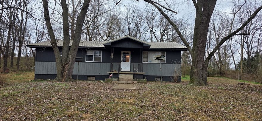 Comfortable country living.  This home is sitting on a secluded 4.25 acres M/L with small natural spring fed stream running through it.  Home features 3 bedrooms, 11/2 bathrooms, with a nice sized living room and kitchen.  A full walkout basement provides ample storage/workshop area.  Home is close to beautiful Bull Shoals lake that has outstanding fishing and recreational activities.