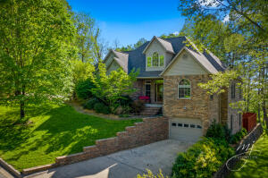 This stunning custom home features an additional, fully self-contained living quarters in the basement, including a second laundry room, kitchen, and a Safe Room for storms. Throughout the home you will find beautiful tile, marble and gorgeous hardwoods that make it a warm and inviting place to live. There are two levels of perfect entertaining space making this home is a ''Must See''. The patio, hot tub, and deck just add to all the other features of this wonderful home. You will also enjoy the space an privacy with the additional lot behind. This property goes from street to street. Seller is downsizing and this is the perfect time for you to step into this beautiful home!