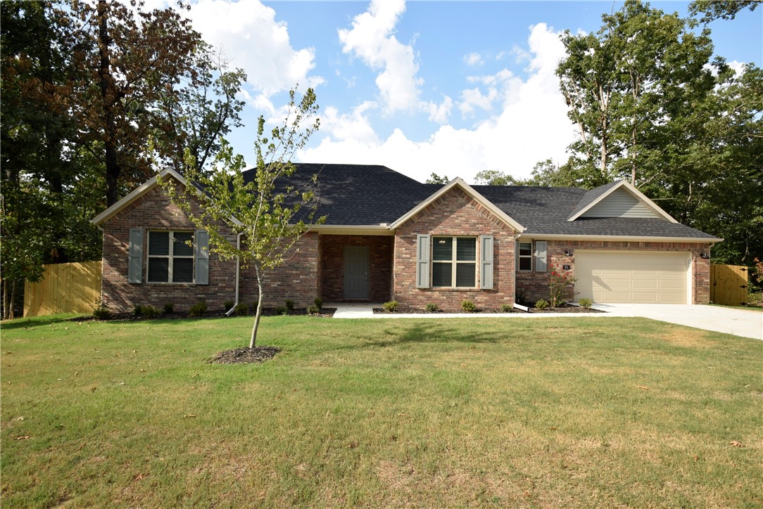 Welcome home to Bella Vista, just minutes from Lake Loch Lomond! This inviting one-level home features a rare level, fully fenced, tree-lined backyardāperfect for kids, pets, and family gatherings. Inside, enjoy a cozy fireplace, soaring cathedral ceiling, wood floors, and stylish trim. The kitchen is designed for everyday living with a large island, granite counters, custom cabinets, and stainless appliances, while the dining area overlooks the backyard. The ownerās suite offers a relaxing whirlpool tub, separate shower, and walk-in closet. A versatile flex room is ideal for a playroom, office, or home gym. Thoughtful extras include a built-in mud bench with cubbies, 2" faux wood blinds, gutters, fully sodded lawn, and professional landscaping. With a 1-year builder warranty, youāll have peace of mind while enjoying all Bella Vista offersālakes, bike trails, golf, pools, and more. Donāt waitāschedule your showing today!