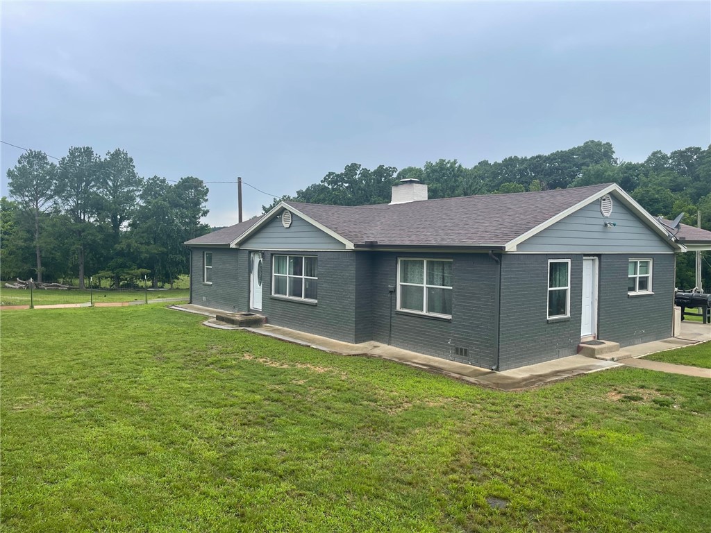 Very nice home total Electric. 4 beds, 2 bath, 2,035 sq ft, all brick, roof 6 yrs old, small creek runs along the back of the property, nice back porch, get away from it all with 5 beautiful acres in the country.