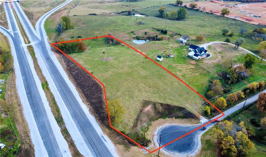 4.18 prime acres at the center of NWA’s largest project. This property will have major future traffic visibility, whether you're commuting 412 or heading to XNA. Running adjacent to the new 612 bypass and just west of the Hwy 112 exit expansion. Great place for your business, advertising, or residential development! Don't miss this unique opportunity!