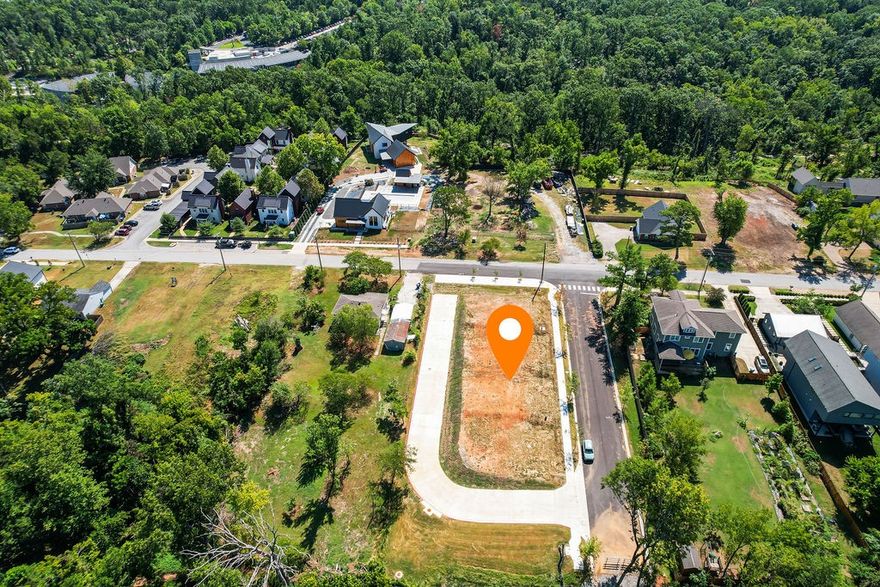 Ready for your development. 2 building lots, driveway and sidewalk already paved. Located directly behind Crystal Bridges and a 1/2 mile to the Downtown Square. Hop on the Zeppelin multi-use trail right from the property to ride the Slaughter Pen trail system and beyond. Recorded plat and covenants attached in MLS - This listing is for Lots 34 and 35 (32/33 currently being developed).