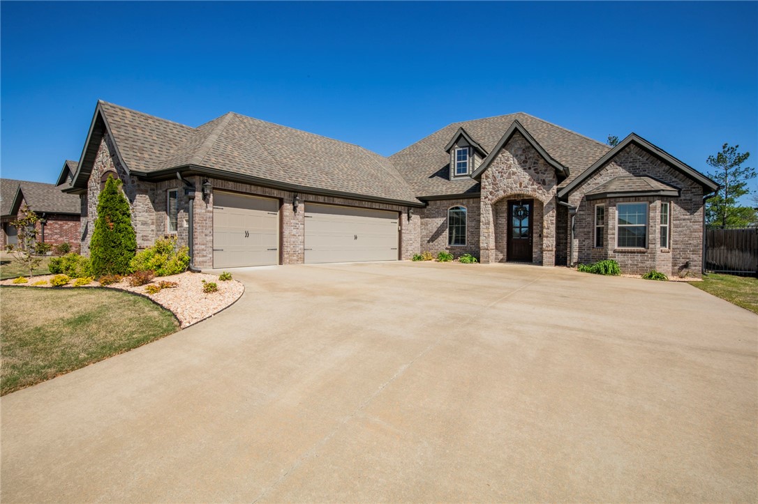 Great modern 1 level home in Southwest Bentonville! Open plan with 4 spacious bedrooms plus office. Kitchen includes center island, stainless appliances, custom soft-close cabinets, 5 burner gas stove, vented hood, and large pantry. Dedicated office or extra den. Separate laundry room. Large primary bedroom. Primary bath includes soaker tub, 2 separate vanities, wrap around master closet. Additional closet in primary bedroom. Great lot backing up to green space. Awesome covered patio with outdoor fireplace. Extended back patio. Convenient location, close to shopping, parks, schools, and more. Community includes pool and playground.